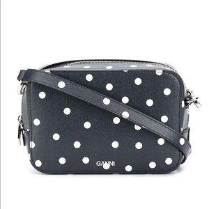 Ganni navy spotted crossbody bag with adjustable and removable strap.